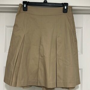 Randy Kemper women’s tan pleated skirt. No size tag, fits 4/6.